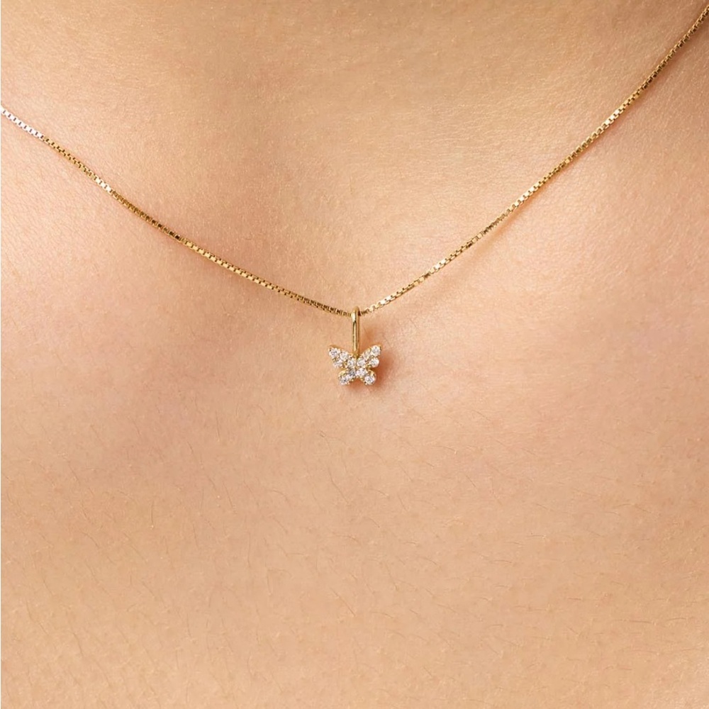 Butterfly mini Birthstone pendant April clear stone in 10k gold